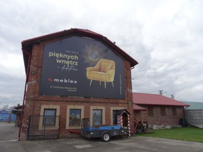 Skrzydło "małego" młyna gospodarczego z 1933 roku, p&oacute;łnocno-wschodnia ściana szczytowa, po prawej stronie tartak.  Materiały Biura Miejskiego Konserwatora Zabytk&oacute;w UM Rzeszowa